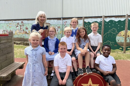 Pupils at Monkwick Infant School with retiring headteacher Claire Holmes