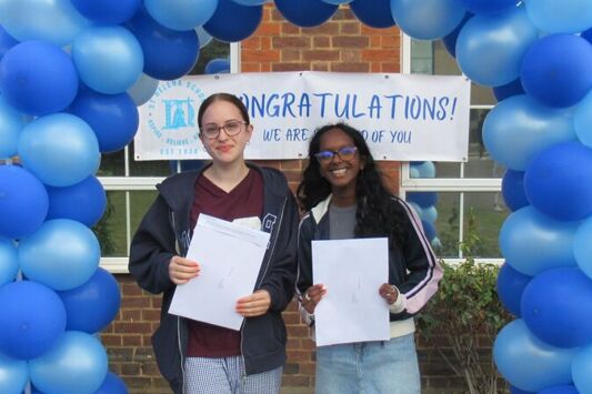 Ellie Taylor and Selvina Ramsamy celebrate their results at St Helena School