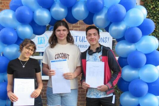 Trinity Cottham, Ollie McGlade and Kourosh Dehghan Nayeri celebrate their GCSE results at St Helena School